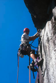 Climber using aid techniques on big wall route.