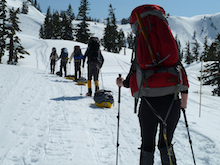 A group practicing sled hauling at the Mt. Baker Ski area.