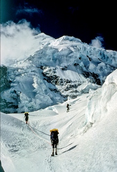 A rope team navigates through complex glacial terrain on a climb of Huascaran.