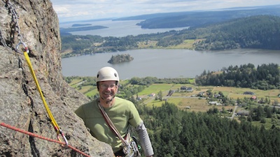A happy climber high on a classic Mt. Erie multi-pitch line, 'Zigzag'