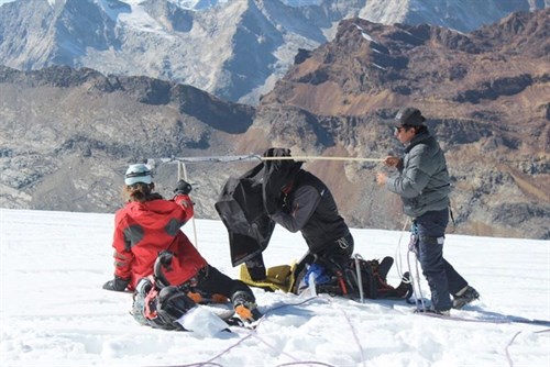 Climber Researchers Measuring Dust