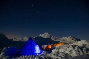 Mt. Baker in the moonlight during an early season Denali Prep course.