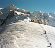 Backcountry riders booting up Shuksan Arm after ducking the ropes at Mount Baker Ski Area.