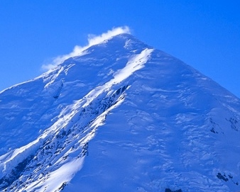 Mount Crosson from Denali Base Camp. The climbing route is the sunlit ridge at center.