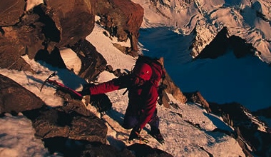 Climbing through the summit rocks on Mt. Cooks' Linda glacier route.