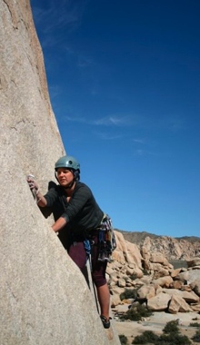 A climber leading up Buissonier (5.8-).