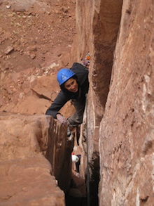 A climber enjoys some moderate terrain on wingate sandstone.