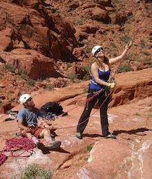 Beginner climbers working together to provide a safe belay.