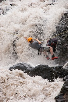 AAI Guide Kurt Hicks navigates a roaring river with a tyrollean traverse