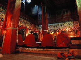 China, Reddomaine - Monks of the Kangding Monastery during their morning sutras.