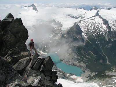 Climbing the picturesque West Ridge of Forbidden Peak with Eldorado in the background.