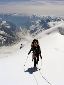 A climber on the approach to basecamp on Mt. Waddington with the expansive Coast Mountains in the background