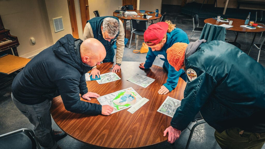 Students learn how to navigate in the backcountry at AAI's Mountain Center during a Backcountry Navigation course