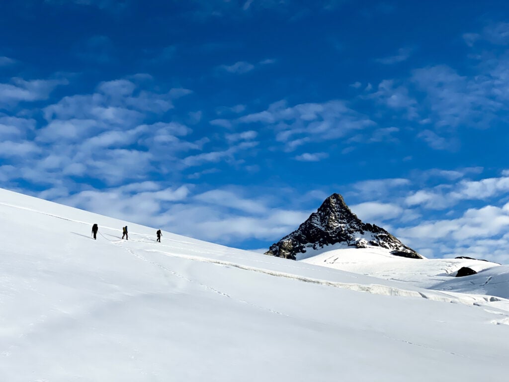 Climbers navigate crevasses on Sulphide Glacier of Mt. Shuksan during an AMTL 1