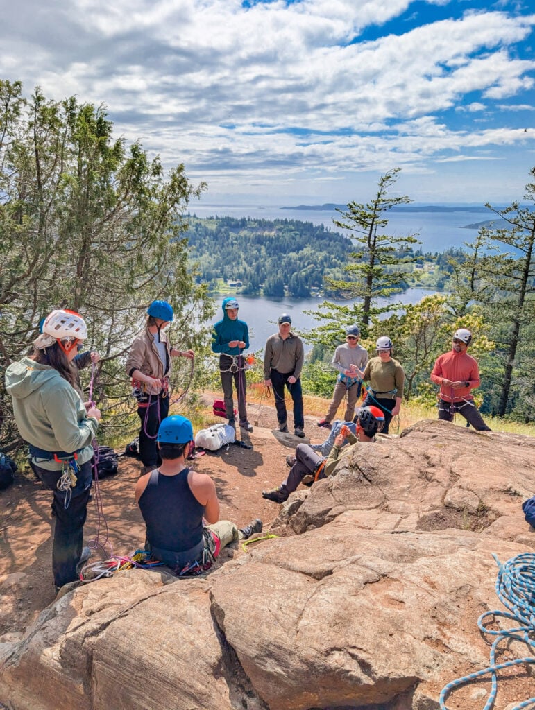 Rock climbing students listening to instruction at Mt. Erie