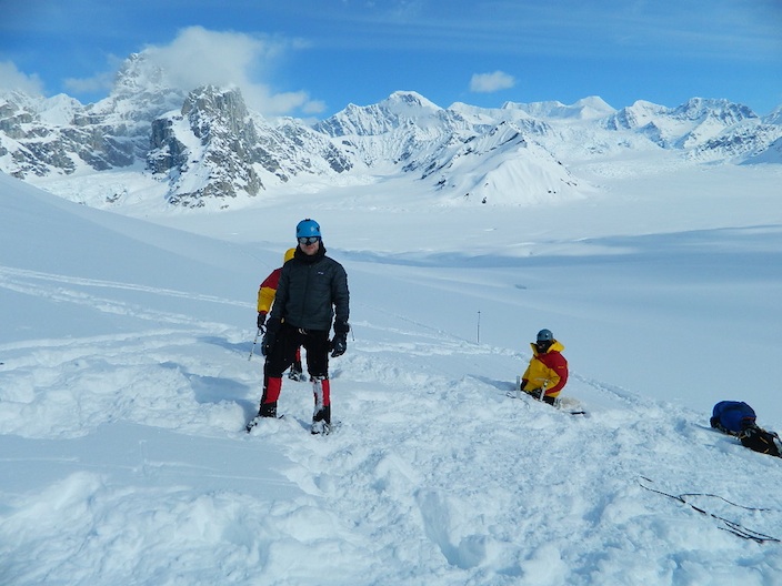 AAI climber building snow anchors on the Ruth Glacier