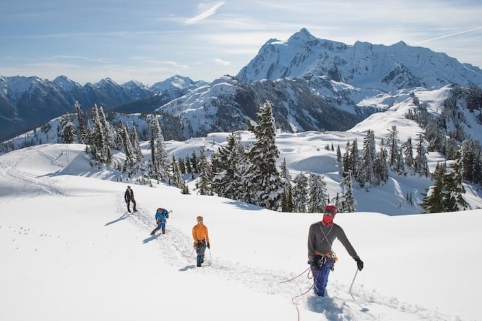 A Denali Prep Team practicing rope travel. Mt. Shuksan in the background. Alasdair Turner.