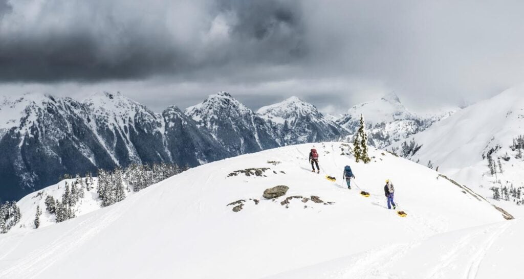 A Denali Prep team dragging sleds to camp.