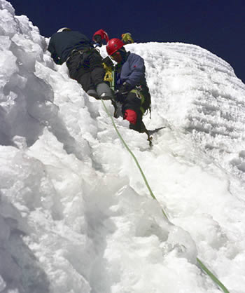 Climbing steep snow Toqllaraju