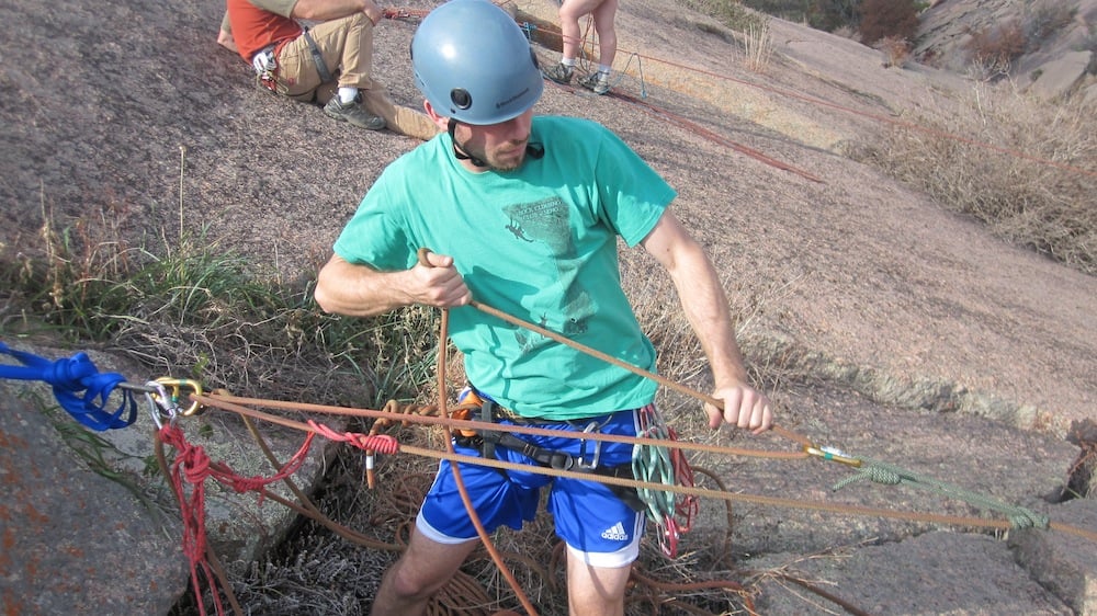 A climber practices hauling another climber at Enchanted Rocks State Park in Texas on an American Alpine Institute rope rescue course
