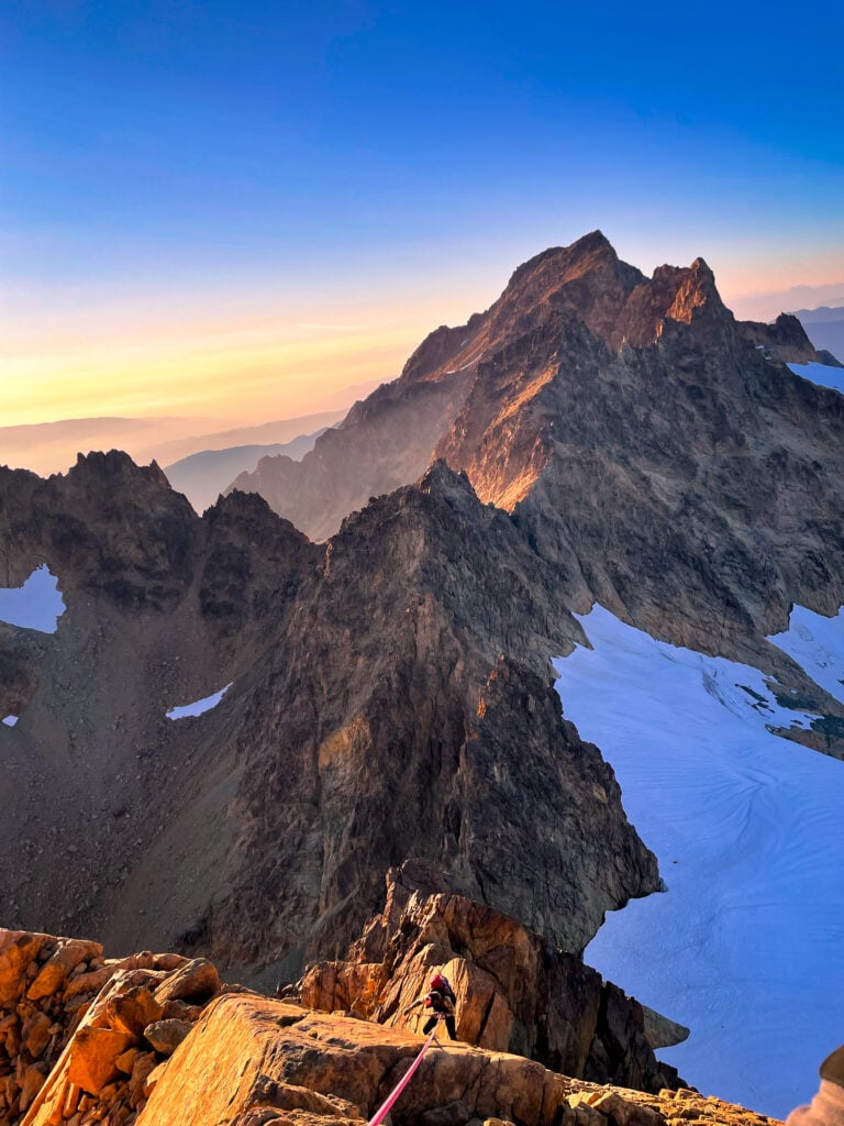 Climber ascends scenic ridge of the Twin Sisters Range in Washington on an Alpinism 2