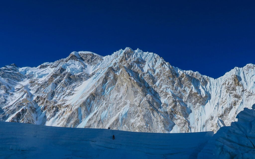 Dwarfed by the mountains