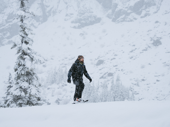 Snowshoeing snowy ridgeline path near Artist Point