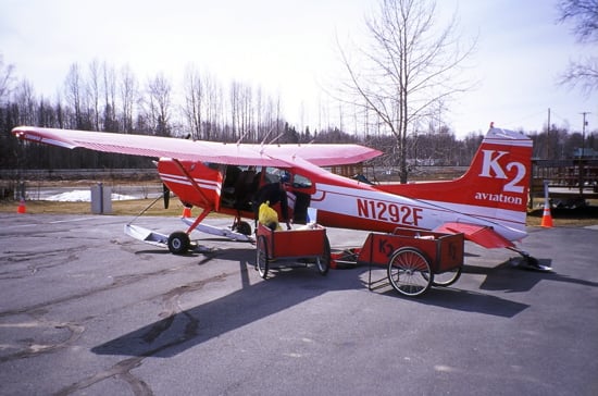 Depending on the size of our group, we will fly in one of K2's Cessna 185's, De Havilland Beavers, or an Otter. An AAI guide loads a Cessna 185 with group gear.