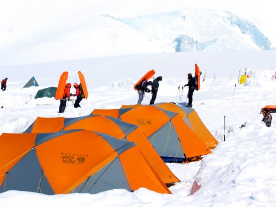 Climbers load rig their sleds for a back-carry from Camp 2 to our cache at 10,500 feet.