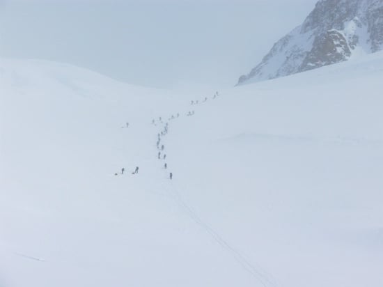 Climbers ascending Motorcycle Hill with sleds in-tow.