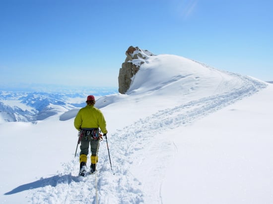 AAI Guide Erik Johnson leads a rope team to the 'edge of the World' on the edge of the plateau at 14k.