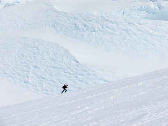 The Fixed Lines and the Ridge to High Camp 3 A lone skier traverse under and immense serac below the fixed lines.
