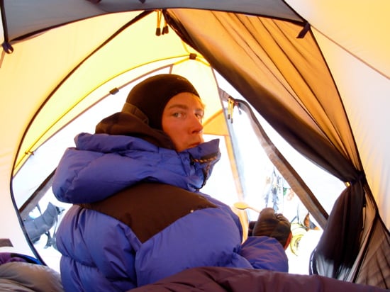 AAI guide Erik Johnson works on the group dinner at High Camp.