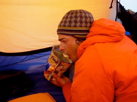 Guide Matt Anderson digs into another tasty dehydrated meal at High Camp.