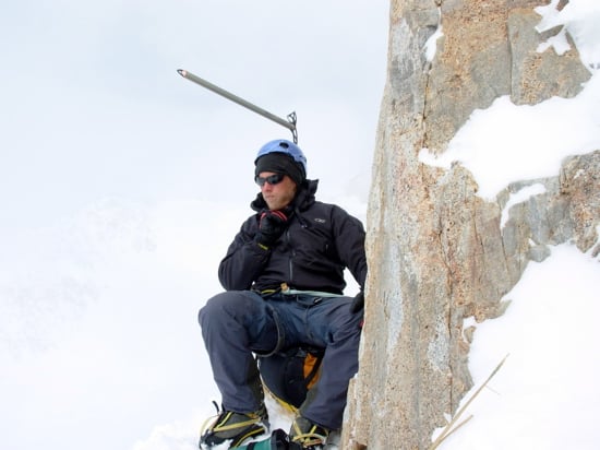 Guide Erik Johnson contemplates the cause of his altitude headache outside of High Camp.
