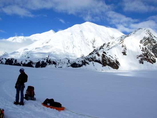Lower Kahiltna Glacier 4 AAI guide Matt Anderson takes a break and enjoys the early morning shade on the lower Kahiltna.