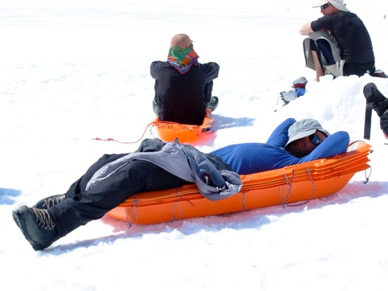 Denali Base Camp 23 Climber Jason Ferns taking a load off after descending from 17,200 feet to Base Camp in one day.