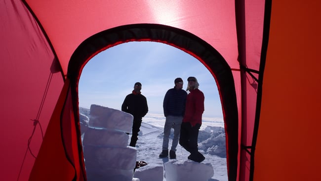 AAI guides talk strategy on a rest day before their summit attempt.