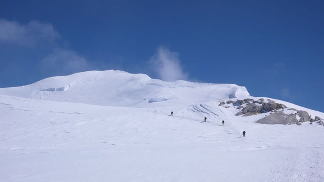 Approaching the base of Pig Hill, the last obstacle before the summit ridge.