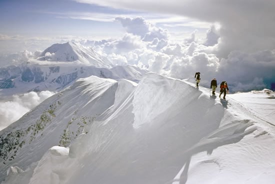 An AAI group walking along the final bit of ridge below the summit of Denali.