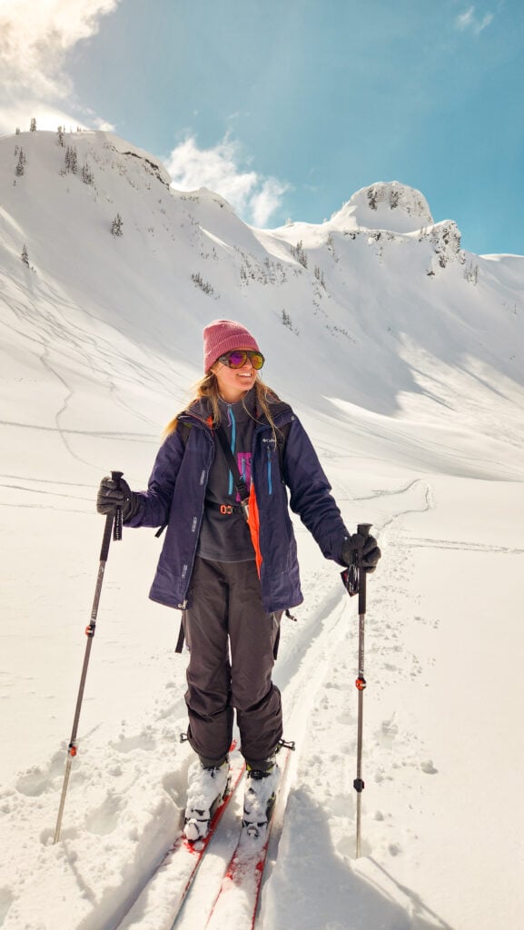 An American Alpine Institute AIARE and Backcountry Ski student enjoys the sunny weather in the Mt. Baker backcountry in Washington