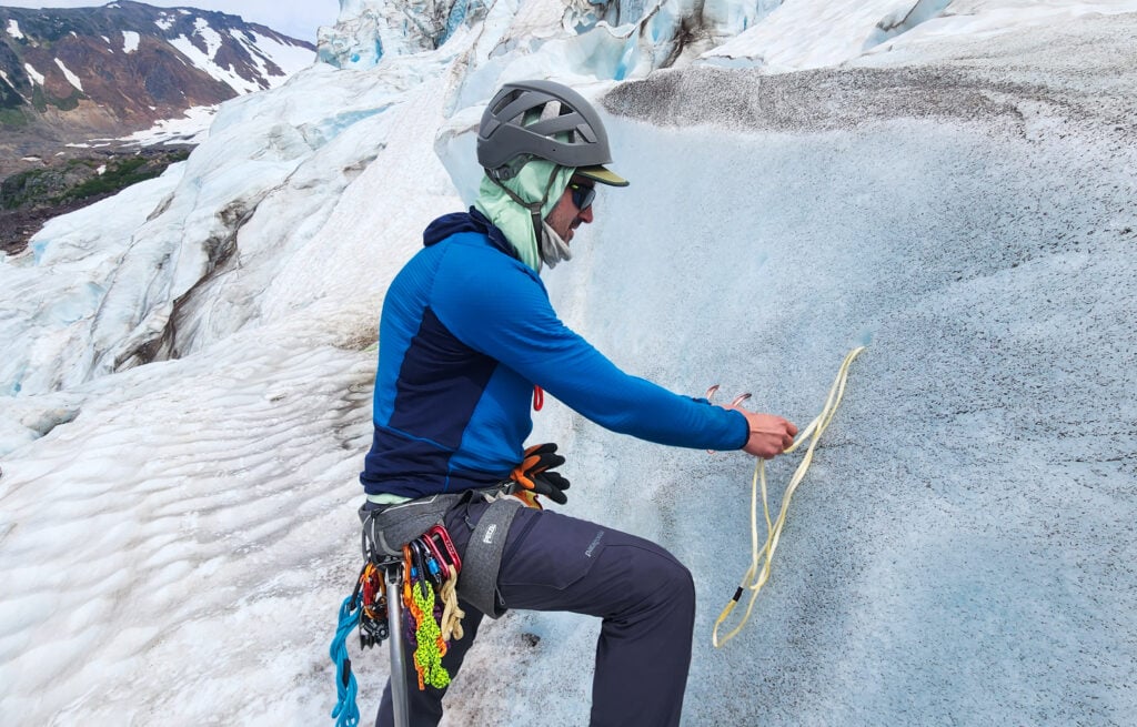 A student climber practices building an ice anchor with v-threads and ice screws during the Alpine Ice instruction portion of the AMTL 2 program