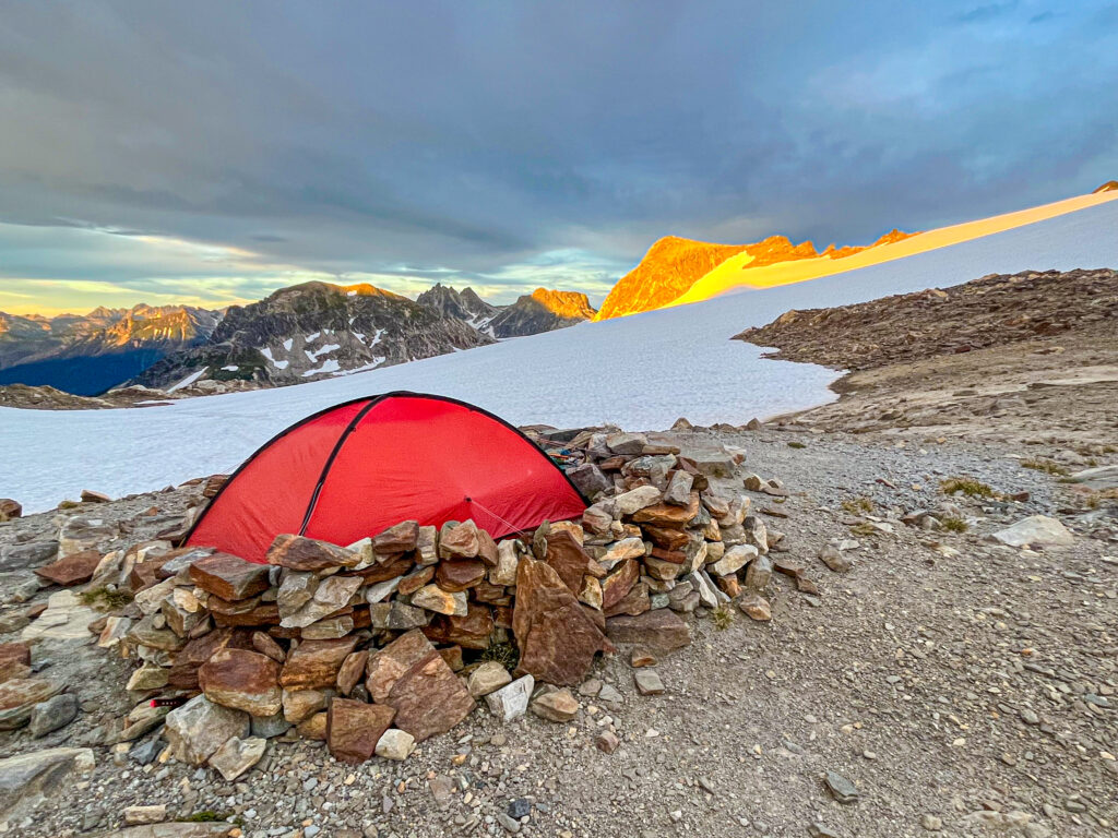 A tent sits at cozy basecamp on Glacier Peak on an American Alpine Institute mountaineering course