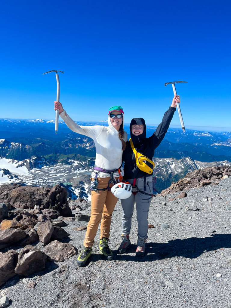 Climbers celebrate their summit of Glacier Peak during an American Alpine Institute mountaineering program