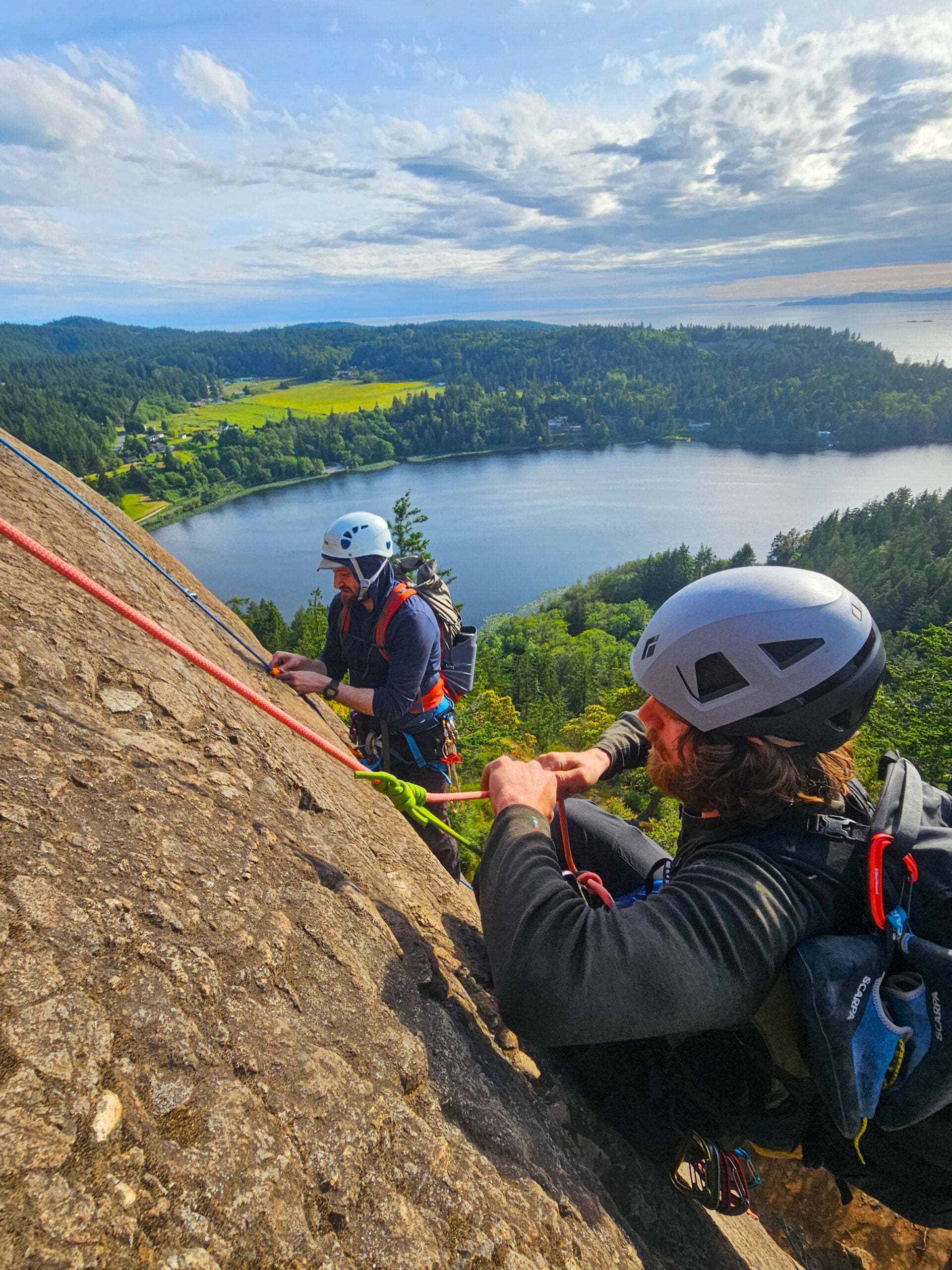 Students learn rock climbing knots and movement at Mt. Erie above the Puget Sound of Washington on an American Alpine Institute rock climbing course