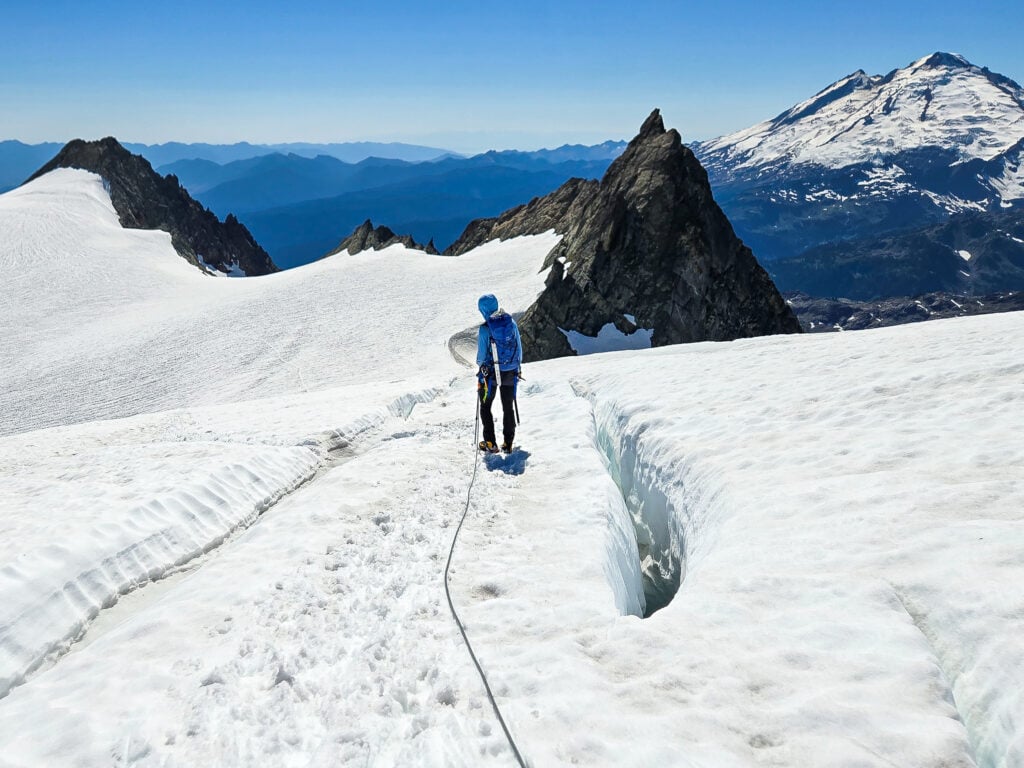 Climbers navigate crevasses on the Sulphide Glacier of Mt. Shuksan during an American Alpine Institute mountaineering program