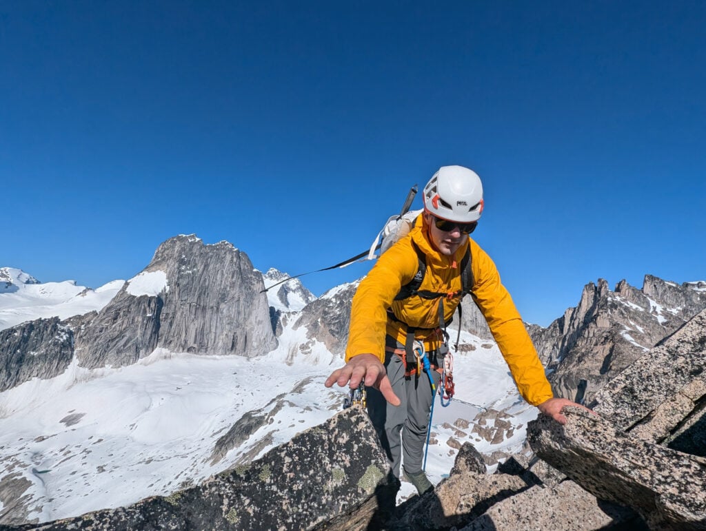 A climber reaches for the next hold as he ascends a classic cascades area peak with the American Alpine Institute