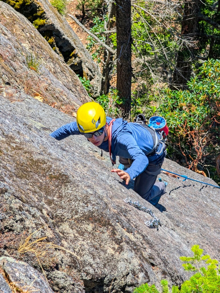 A student climbs higher on the route during an American Alpine Institute Leaders of Tomorrow Rock Climbing Camp