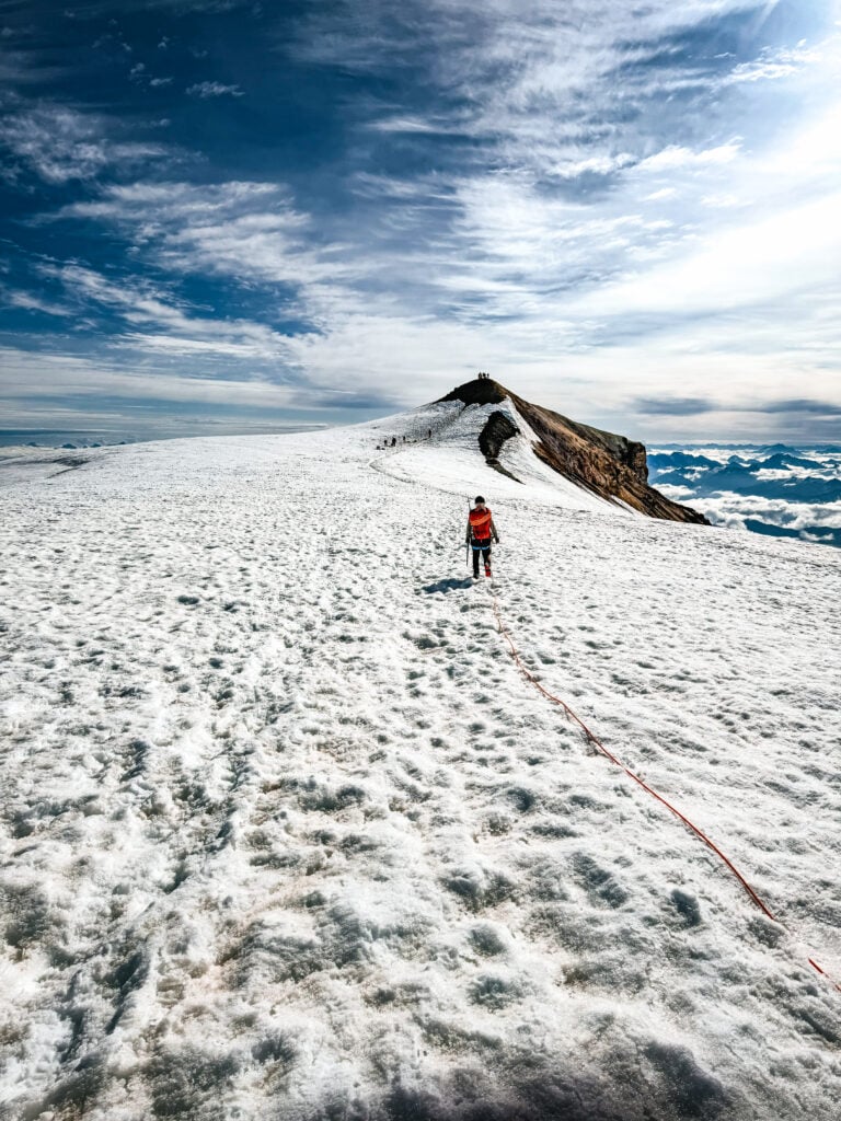 Students walk toward the true summit of Mt. Baker on the American Alpine Institute Leaders of Tomorrow Summit Camp