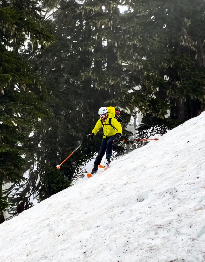 A skier navigates spring snow in the North Cascades backcountry on an American Alpine Institute ski program
